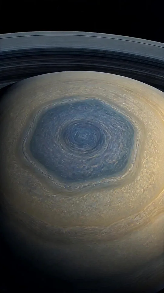 Illustrated hexagonal cloud pattern above Saturn